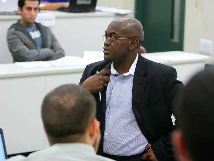Dr. Rupert A. Hayles Jr. listening closely to a participant at Seton Hall University